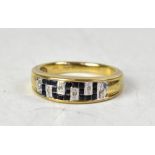 A 9ct gold ring with diamond and sapphire in a Greek Key pavé set design, size O, approx 3.2g.
