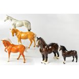 BESWICK; five horses comprising a shire horse, two palomino horses, one with a raised leg,