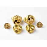 A pair of 9ct gold clip-on earrings of knot form,