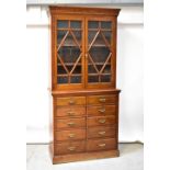 An early 20th century walnut bookcase,
