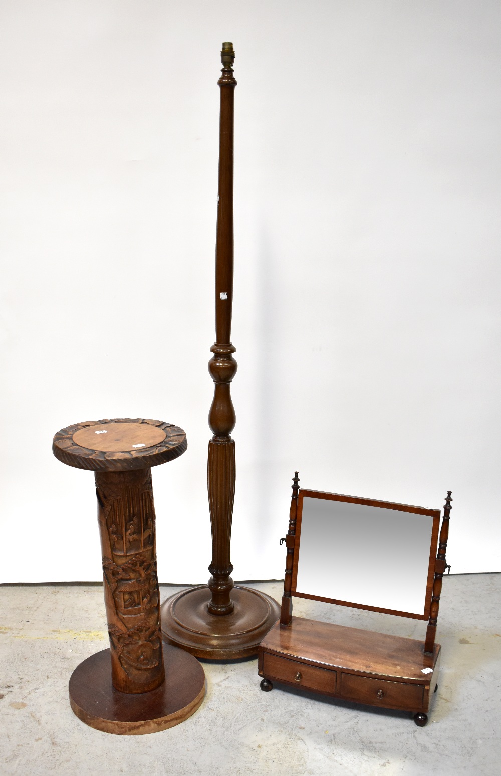 An early 19th century mahogany swing toilet mirror with two drawers to the faux fronted base,