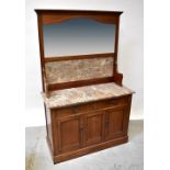 An Edwardian mirror back rouge marble top wash stand with string inlay,