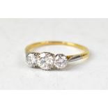 An 18ct three-stone diamond ring,