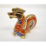 ROYAL CROWN DERBY; an Imari decorated porcelain dragon paperweight, height 11.