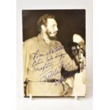 FIDEL CASTRO; a black and white photograph bearing the leader's signature,