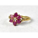 A 9ct yellow gold diamond and ruby flowerhead ring,