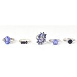 Five sterling silver rings set with blue stones,