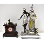 A contemporary silvered and gilt-heightened resin figural mantel clock and a further small stained