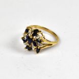 A modern 9ct gold diamond and sapphire cluster ring,