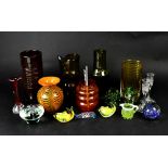 A group of decorative coloured glass including a green tinted vase, jug, turquoise coloured vase,