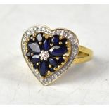 A 9ct gold sapphire and diamond ring, the head in the form of a heart,