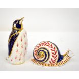 ROYAL CROWN DERBY; two Imari decorated porcelain animal paperweights, comprising a penguin,