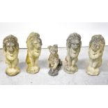 Four composite stone statues of lions, each seated in upright position, height 56cm,