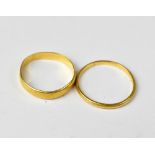 Two 22ct gold bands, thinnest size M, the other size K, combined approx 3.2g (2).