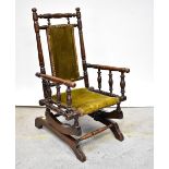 A child's late 19th/early 20th century American-style rocking chair with bobbin turned frame and