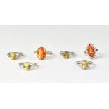 Six various coloured quartz rings on sterling silver shanks,