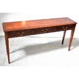 A reproduction mahogany line inlaid and crossbanded three-drawer side table,