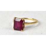 A 9ct gold ruby ring, the single octagonal claw set ruby approx 1.