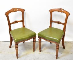 A set of six Victorian walnut bar back dining chairs with carved detail to the top and centre rails,
