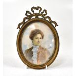 A THUMETTE; a 19th century watercolour portrait miniature, young woman in period costume,