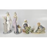 LLADRÓ; four large porcelain figure groups, comprising an Art Deco lady with puppy by seat,