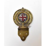 A vintage brass and enamelled RAC (Royal Automobile Club Association),