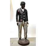 A large fibreglass figure of a young gentleman wearing fez,