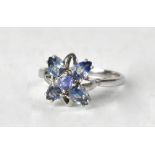 A 9ct white gold ring with blue sapphire flowerhead, size T, approx 3.5g.