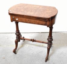 A Victorian walnut games table,