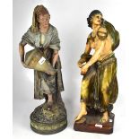 A large painted plaster figure of a water carrier,