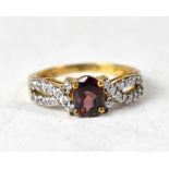 A 9ct gold ring with a claw set oval Cambodian Cinnamon zircon,
