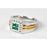 A gentlemen's modern 14K two-tone gold emerald and diamond ring,