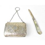 An Edwardian silver purse with engine turned foliate decoration,