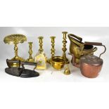 A mixed lot of brass copper and metalware to include jam pan, candlesticks, irons, trivet, etc.