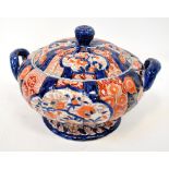 A large 19th century Japanese Imari soup tureen of Kabocha form, with flower finial knop,