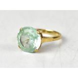 A 9ct yellow gold ring set with a circular pale blue stone, size N1/2, approx 3.6g.