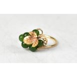 A 14ct yellow gold cluster ring in the form of a bunch of grapes, set with green jade spheres,