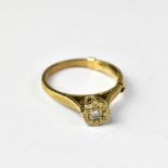 A 9ct gold ring with illusion set central small diamond, size P, approx 2.7g.