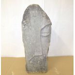 A contemporary carved Lake District stone sculpture of triangular form,