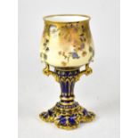 ROYAL CROWN DERBY; an early 20th century goblet decorated with gilt sprays on a cream ground,