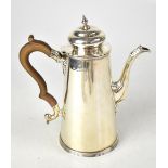 A George V hallmarked silver coffee pot with domed hinged cover,