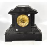 A large late 19th century French black slate eight day mantel clock, height 46cm.