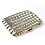 An Edward VIIhallmarked silver small cigar case, with fluted channels and press button release,