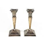 A pair of George V hallmarked silver candlesticks,
