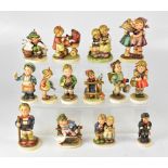 HUMMEL GOEBEL; fourteen porcelain figures to include postman, window cleaner, boy with rabbit,