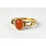 A 9ct yellow gold garnet ring, the central garnet set to open work shoulders, size O, approx 2.7g.