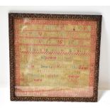 An early 19th century sampler by Caroline Rennison aged 13 in 1847, with alphabet over text,