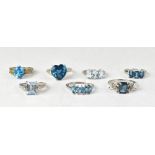 Seven topaz and sterling silver rings,