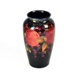 WILLIAM MOORCROFT; an early 20th century tapered vase,