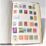 A hobby stamp album containing mostly British Elizabeth II stamps and some partial pages of world